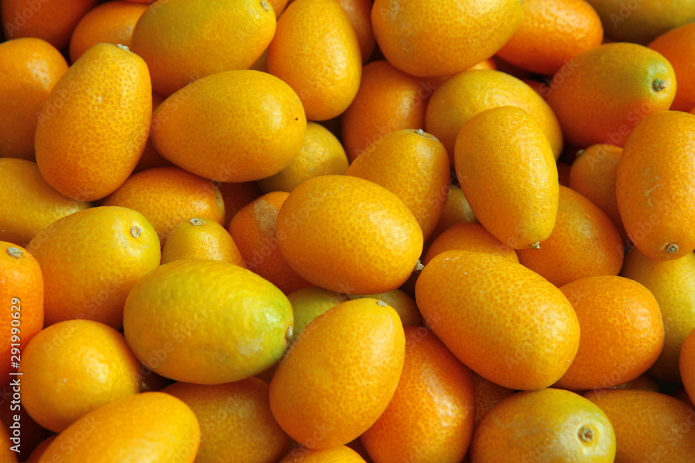 Bunch of fresh kumquats fruits in the organic food market Bunch of fresh kumquats fruits in the organic food market