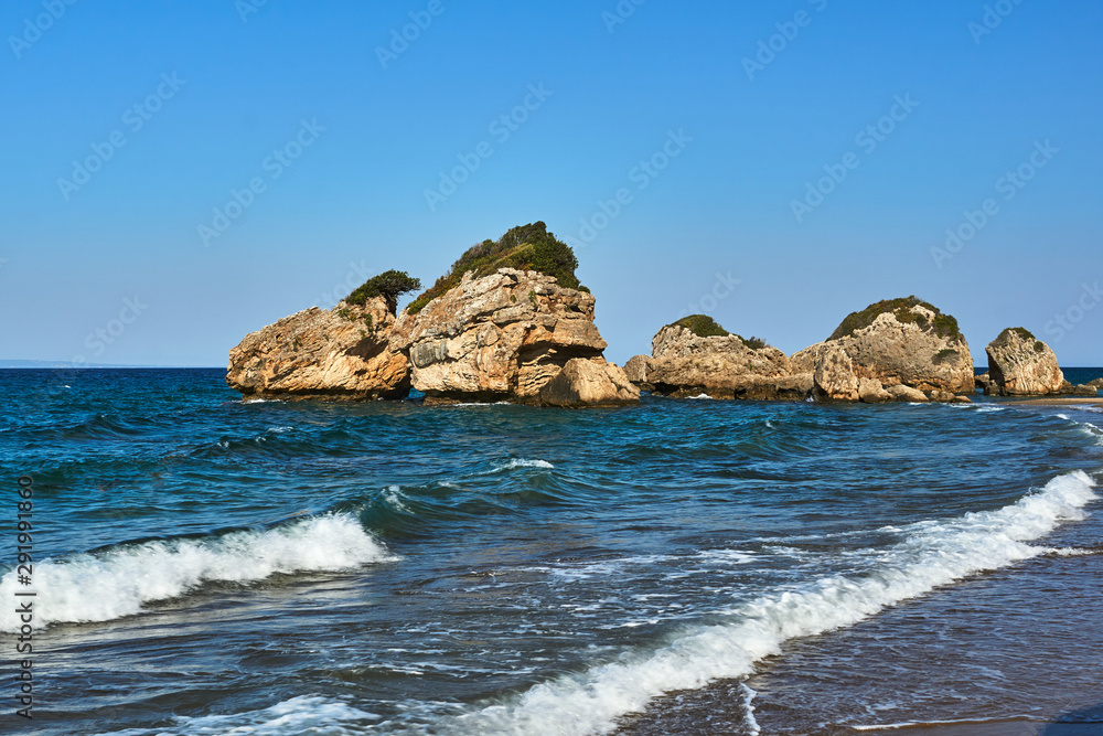 Rocks and boulders on the coast of the island of Zakynthos in Greece.