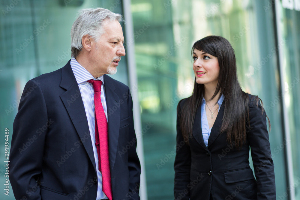 Business partners discussing together outdoor Business partners discussing together outdoor