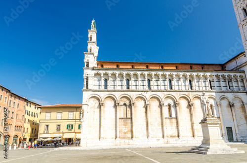 Chiesa di San Michele in Foro St Michael Roman Catholic church basilica on Piazza San Michele square in historical centre of old medieval town Lucca in summer day with clear blue sky, Tuscany, Italy © Aliaksandr