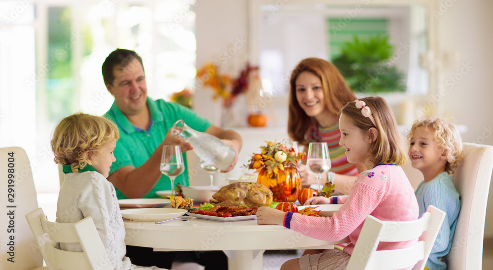 Family with kids at Thanksgiving dinner. Turkey. Family with kids at Thanksgiving dinner. Turkey.