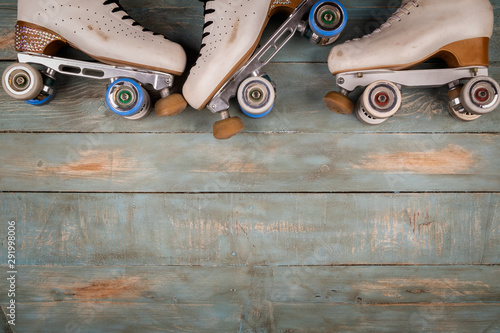 Bilde på lerret artistic roller skates on a wood background