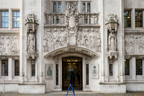 Entrance to the Supreme Court of the United Kingdom, which focuses on cases that are of importance to the general public, like the Brexit ruling, in Parliament Square, London, UK photo