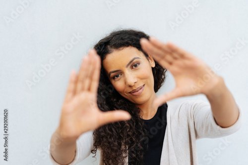 Creative attractive woman making a frame gesture