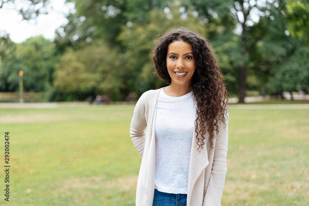 Pretty trendy young African woman in a park Pretty trendy young African woman in a park