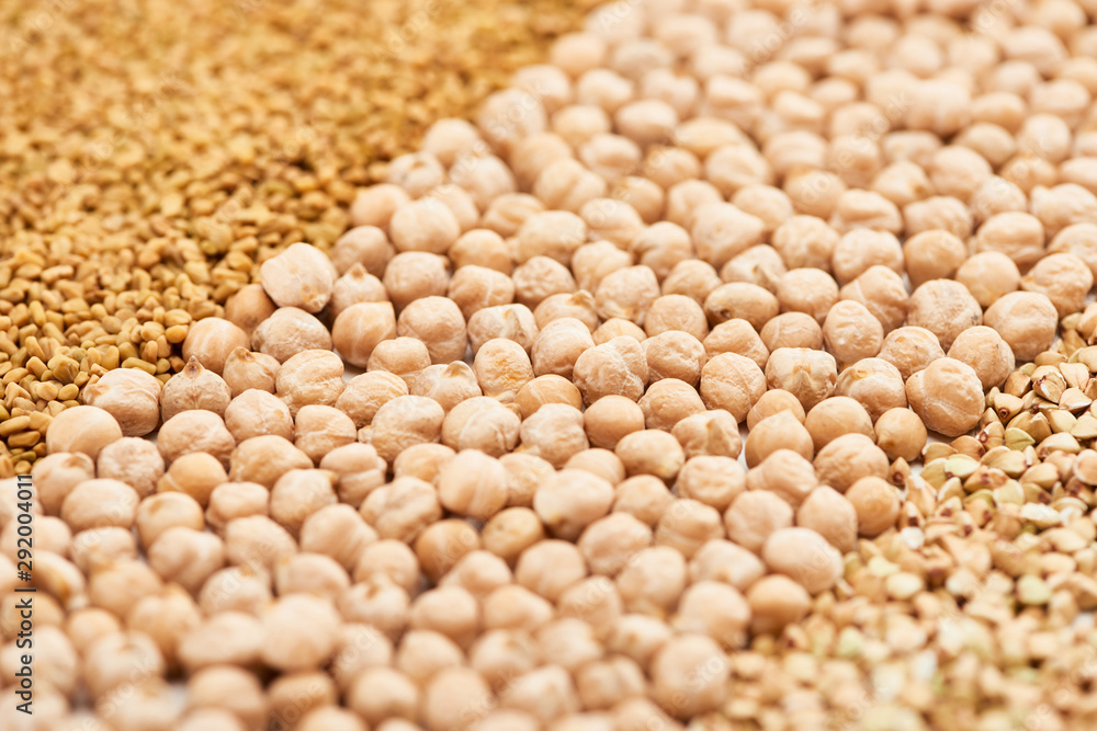close up view of raw chickpea between assorted grains