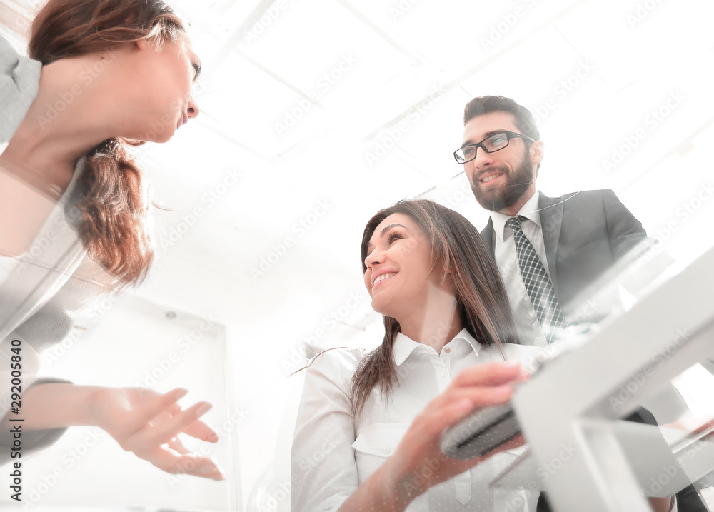 through the glass.business colleagues at the Desk