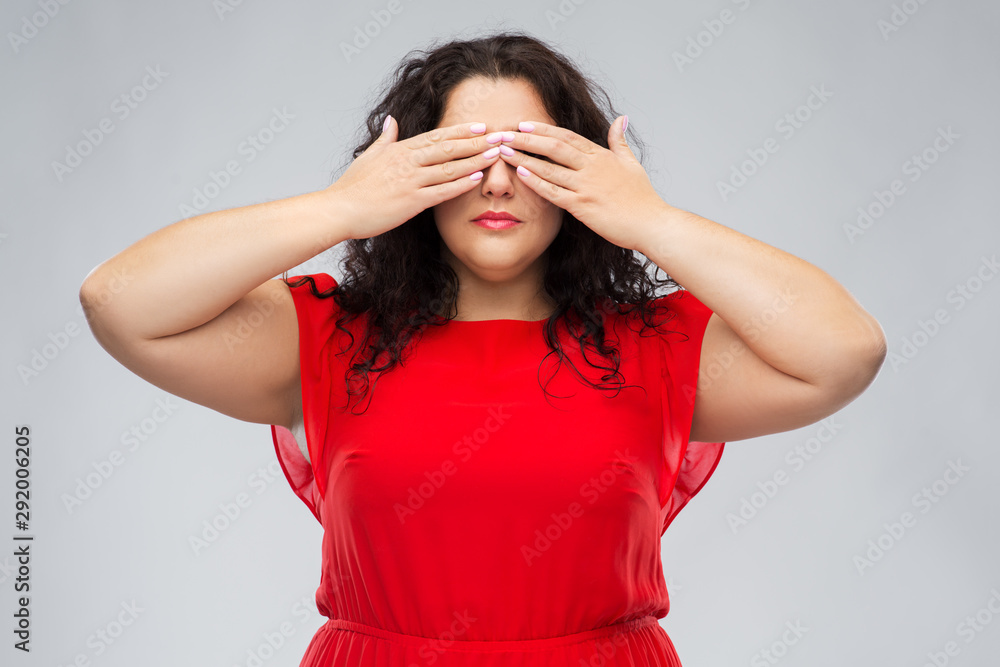 people and vision concept - woman in red dress closing her eyes by hands over grey background people and vision concept - woman in red dress closing her eyes by hands over grey background