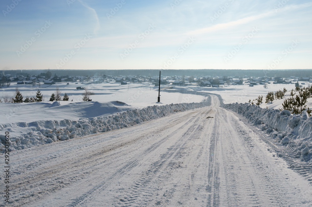Countryside. Image of road to village in winter