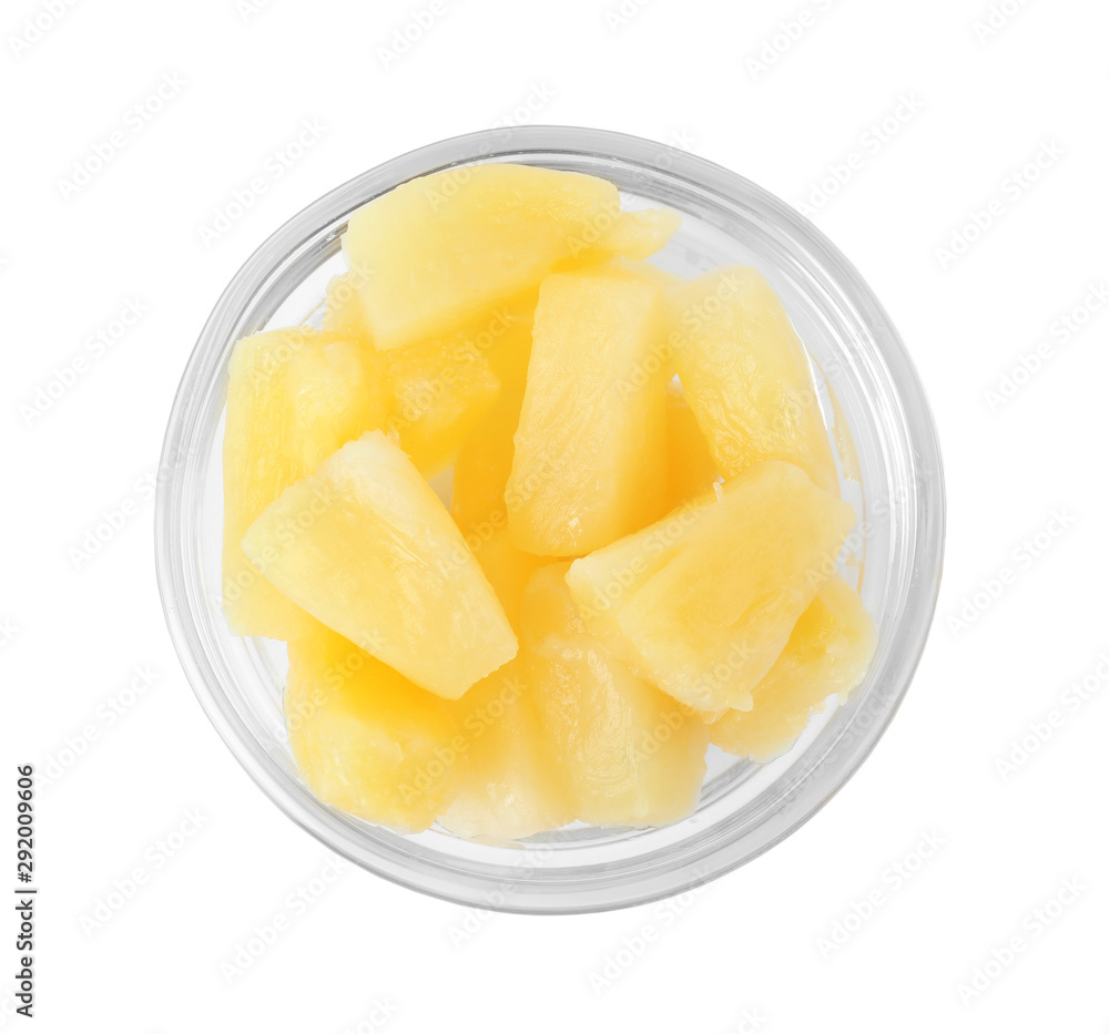Bowl with pieces of delicious sweet canned pineapple on white background, top view Bowl with pieces of delicious sweet canned pineapple on white background, top view