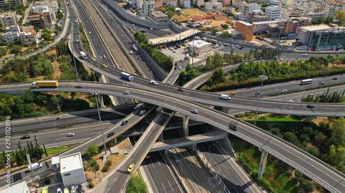 Aerial photo of multilevel junction highway overpass in urban area with beautiful sky and clouds