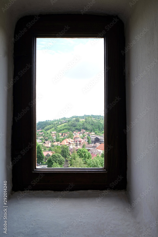 Beautiful view of city and mountain through window Beautiful view of city and mountain through window