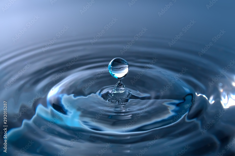 Water splash or drop. Water splash close-up. Blue water drop. Falling water Water splash or drop. Water splash close-up. Blue water drop. Falling water