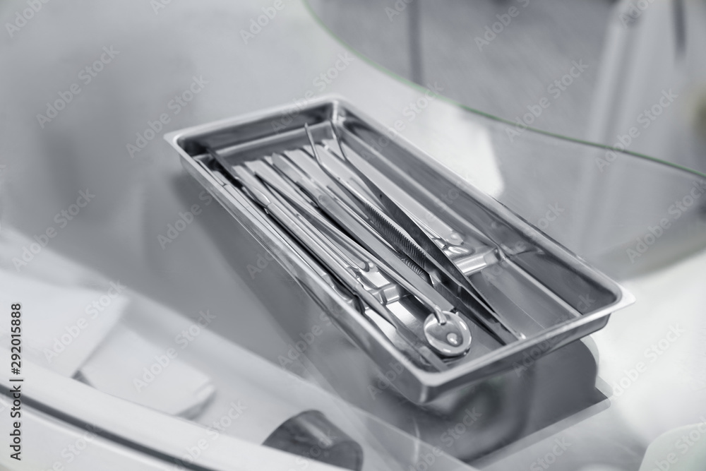 Professional dentist tools on glass table in clinic Professional dentist tools on glass table in clinic