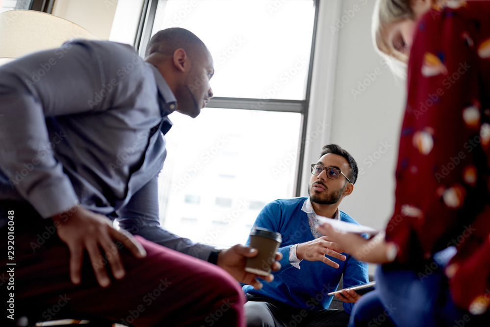 Multi-ethnic team of creative millenials collaborating on a brainstorm project Multi-ethnic team of creative millenials collaborating on a brainstorm project
