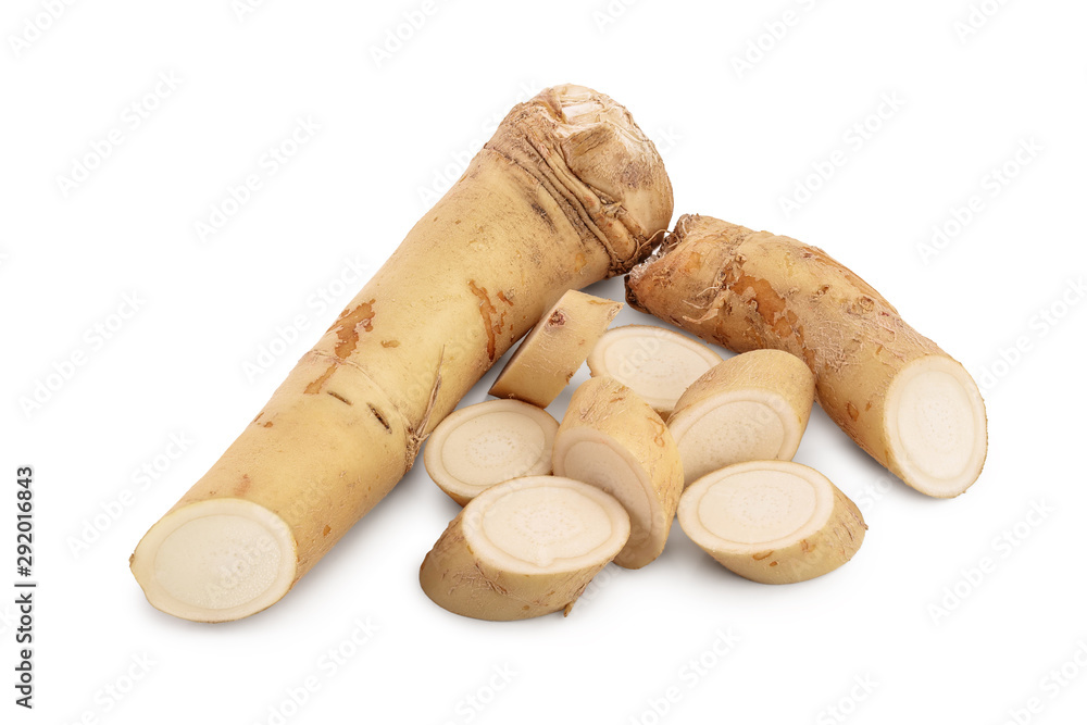 Horseradish root with slices isolated on white background