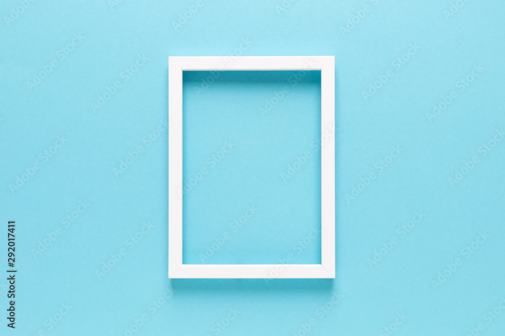 Empty photo frame on blue background with copy space, top view Empty photo frame on blue background with copy space, top view