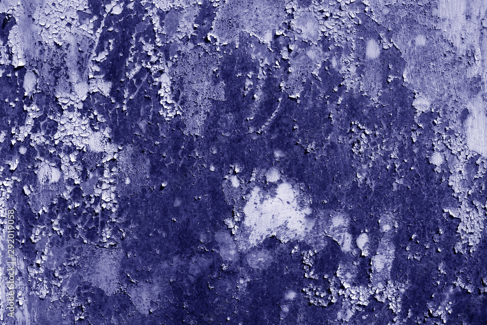 Grungy rusted metal wall surface in blue tone.