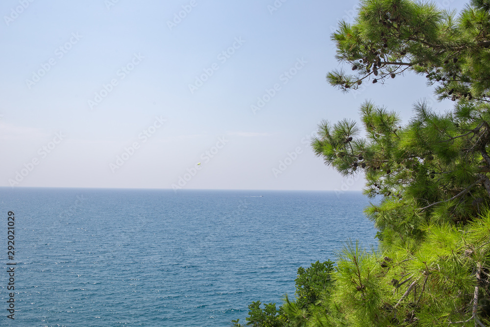 Sunny Alanya beach in Turkey with sea view. Konakli old town View from the fortress on the mountain. Mediterranean Sea