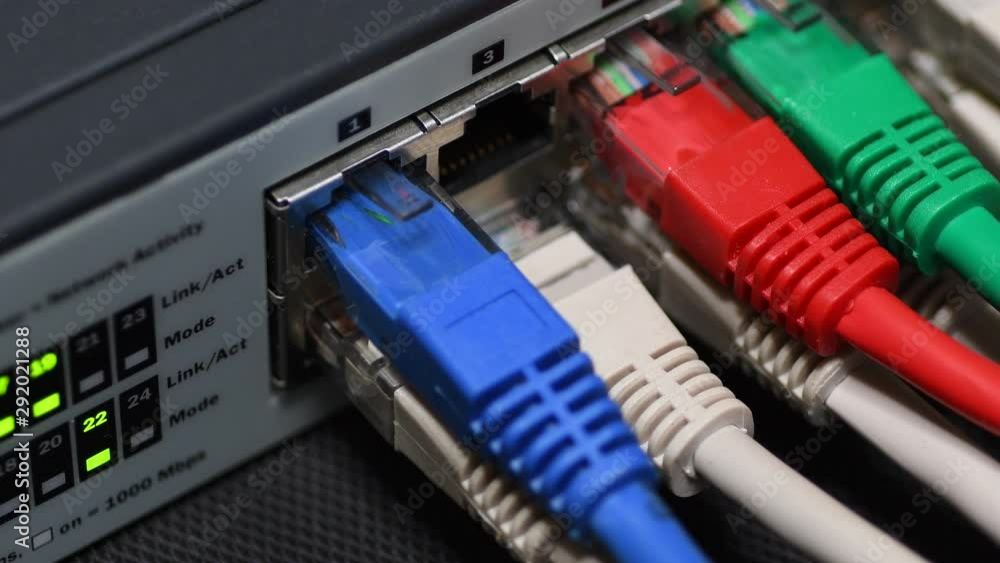 Male Hand Inserts The Yellow Data Lan Cable rj45 Into Network Switch in Data Center. 4K UHD Video. Male Hand Inserts The Yellow Data Lan Cable rj45 Into Network Switch in Data Center. 4K UHD Video.