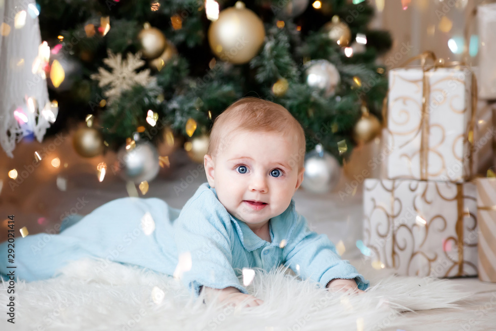  Cute baby on floor at   Christmas tree