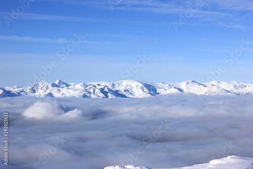 snow-covered mountains over the fog in canada