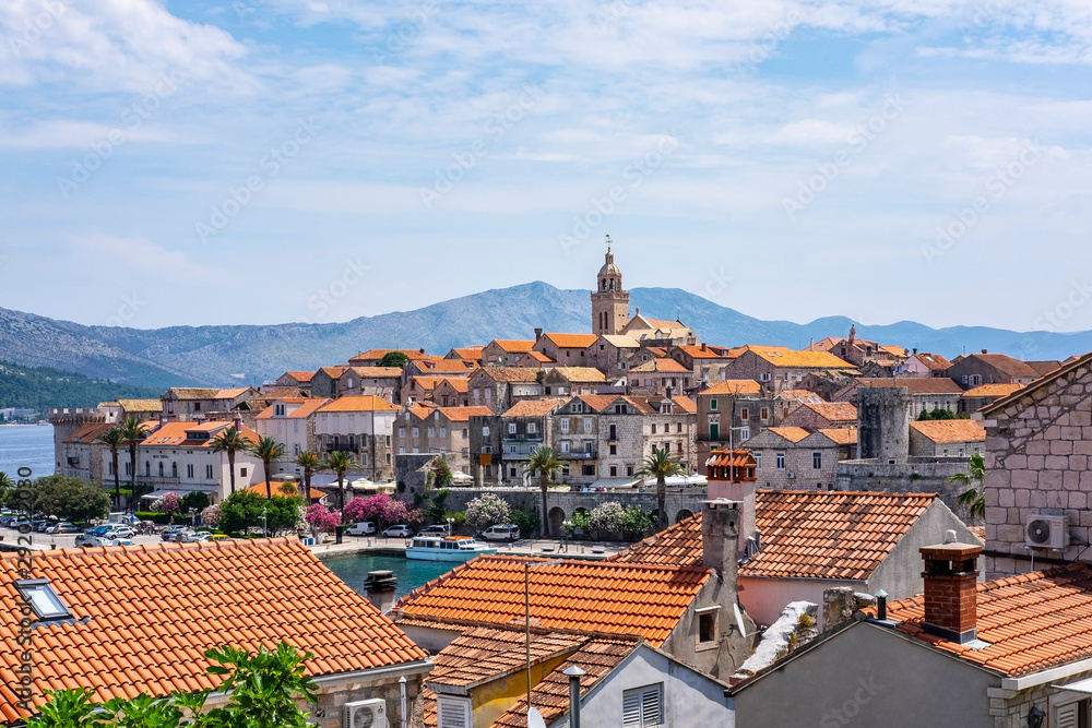 View on picturesque and historic fortified Korcula old town with blue sky and red roofs, Korcula Island, Dalmatia, Croatia