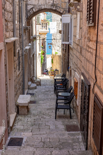 Famous narrow stone street with stone houses and facades in historic fortified Korcula town, Korcula Island, Dalmatia, Croatia