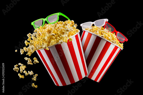 Set of buckets with popcorn and 3D glasses isolated on black background © Vasyl Onyskiv