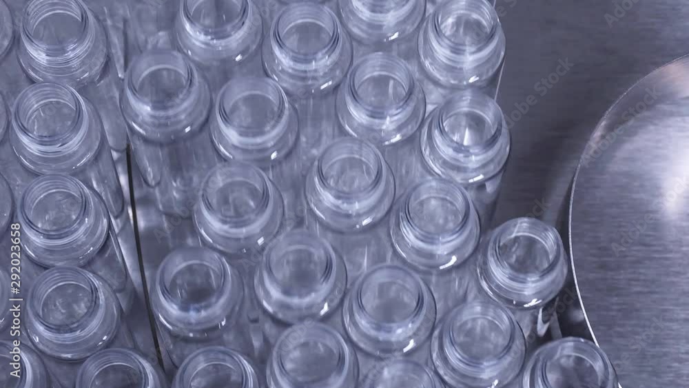 Empty Plastic PET bottles on automated assembly line Empty Plastic PET bottles on automated assembly line