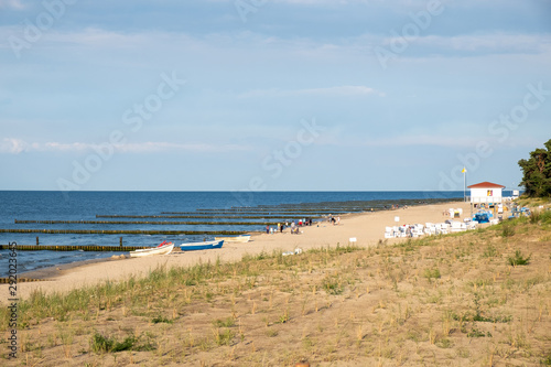 the beach of Zempin on the island Usedom with the lifeguard tower and fishing boats.
