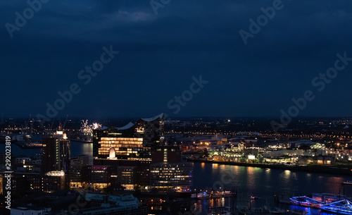 View of the harbor and the new Elbphilharmony of Hamburg with boats at night