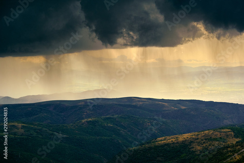 Fototapeta Naklejka Na Ścianę i Meble -  Summer Storm and Rain On Mountains In Spain