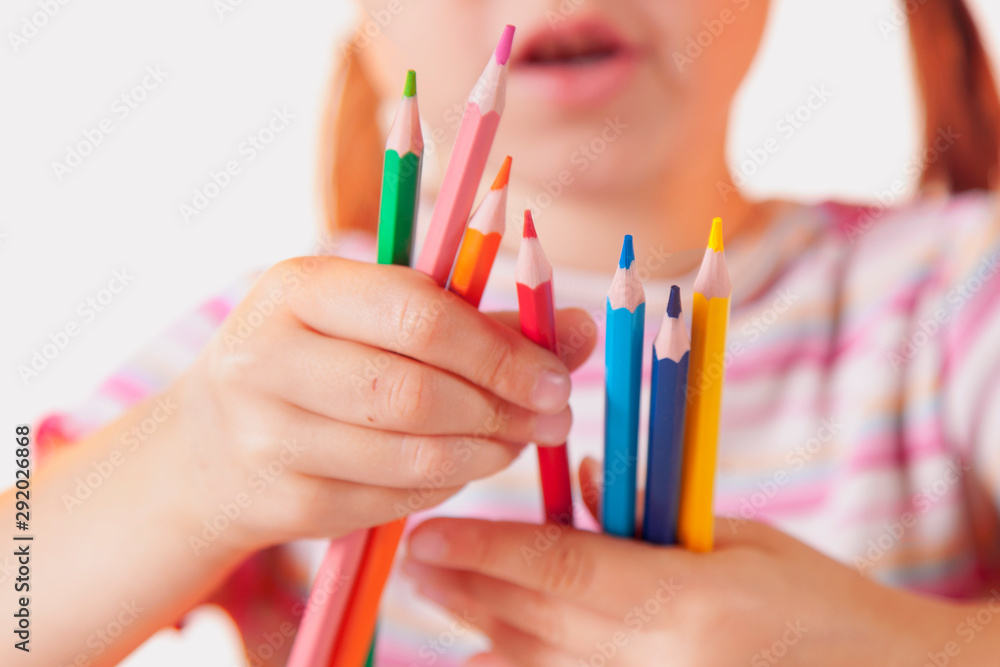 Humorous photo of great artist. Portrait of cute little child girl with colored pencils. Humorous photo of great artist. Portrait of cute little child girl with colored pencils.