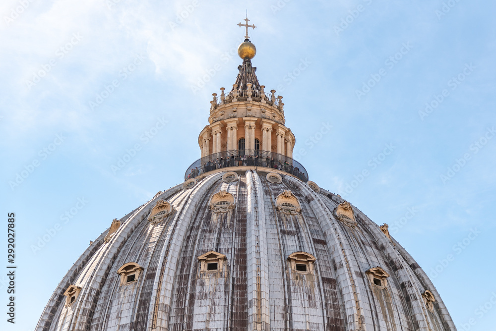 Detailed view of dome summit of Papal Basilica of St. Peter in the Vatican, Rome, Italy