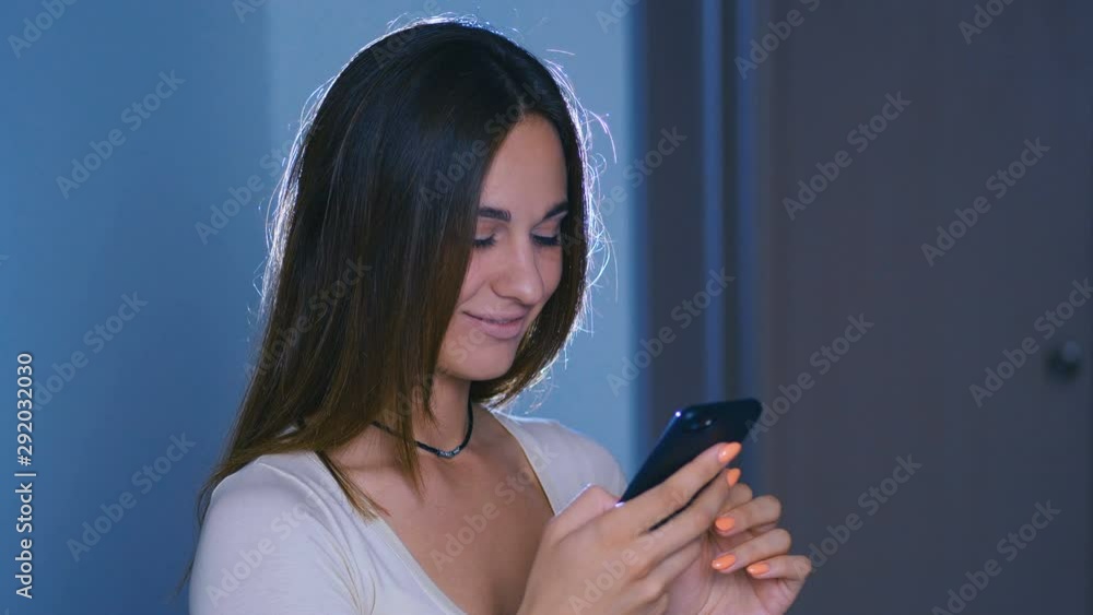 Woman use of mobile phone on at night Woman use of mobile phone on at night