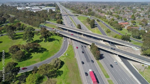 Circular aerial pan around busy highway interchange photo