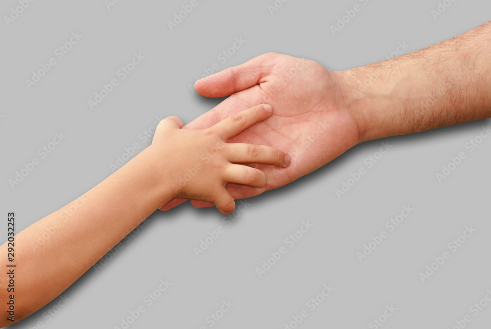 hands of the child and adult