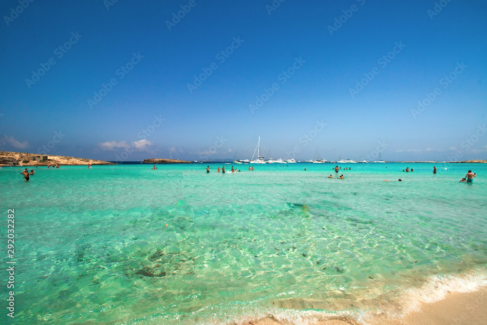 view of the beach with blue sky and clouds