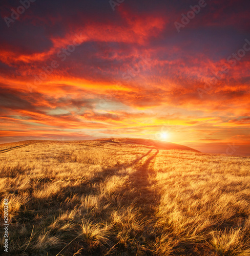 Mountain trail, hiking road on sunset sky background, travel and toursm in wild nature