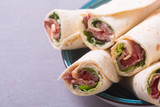 Sliced sandwich tortilla with vegetables and ham