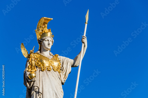 Sculpture of Athena, the Greek goddess of wisdom,outside the Austrian Parliament Building in Vienna, Austria photo