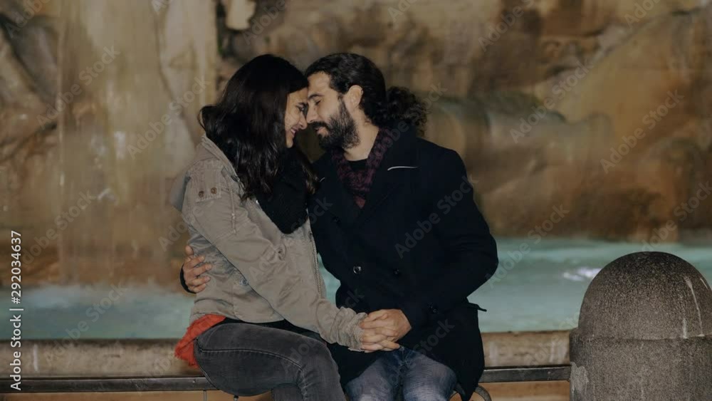 Romance,Love,attraction.Young lovers flirting at night in the city Romance,Love,attraction.Young lovers flirting at night in the city
