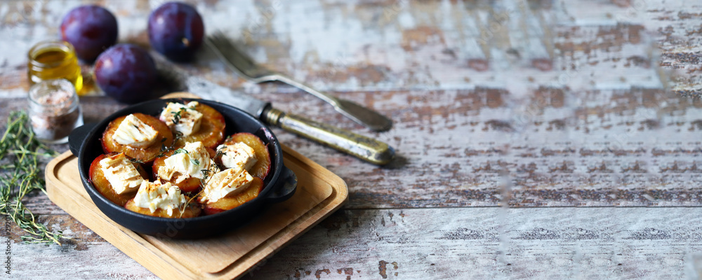 Baked plums with feta cheese. French cuisine Healthy organic food. Baked plums with feta cheese. French cuisine Healthy organic food.