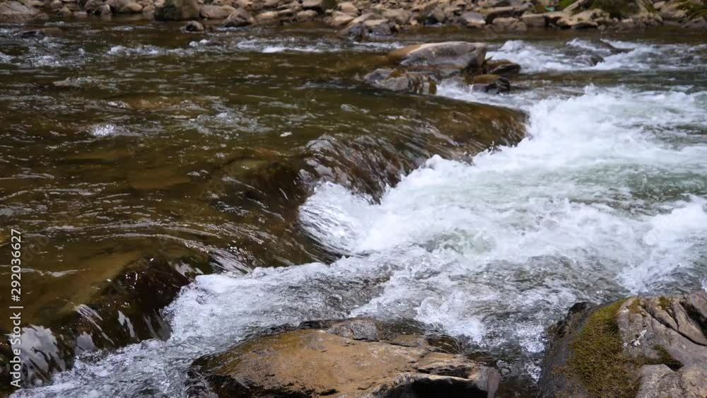 Boiling water of a mountain river in the mountains in summer, large Boiling water of a mountain river in the mountains in summer, large