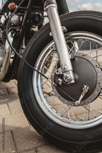 Close up motorcycle front wheel with drum brake