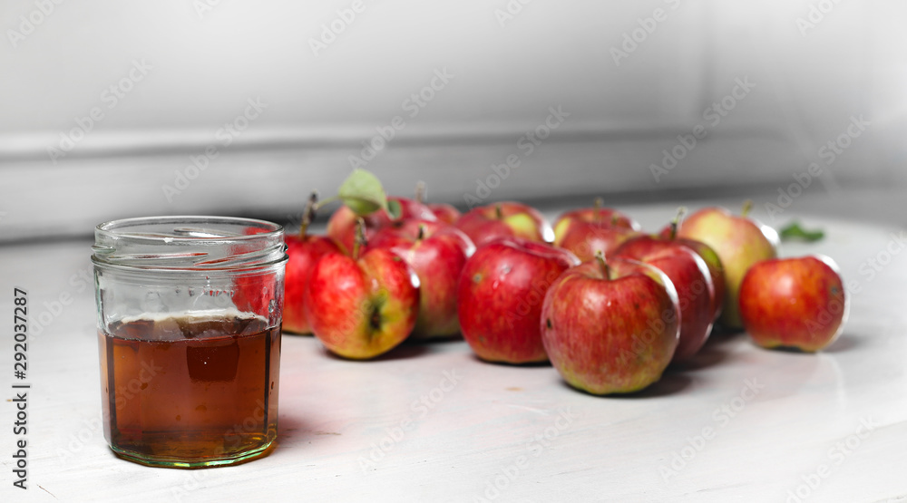 apple juice and apples on Woden Provence table apple juice and apples on Woden Provence table