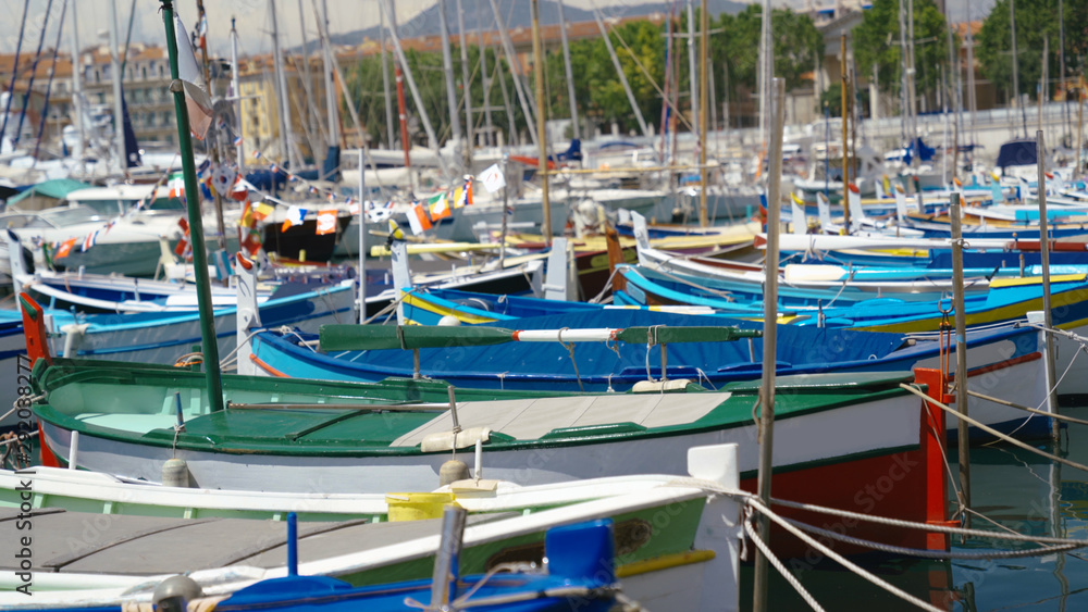 Many Rowboats and Sailboats Used for Fishing Docked in a Port; Each Boat has it's own Unique Colorful Look Many Rowboats and Sailboats Used for Fishing Docked in a Port; Each Boat has it's own Unique Colorful Look