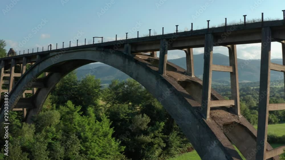 Aerial View Of Old Stone Arch Bridge. Drone pan right. Aerial View Of Old Stone Arch Bridge. Drone pan right.