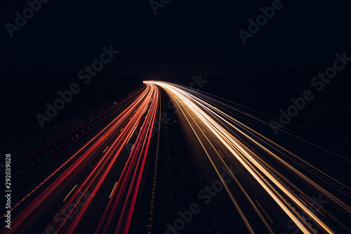 Traffic light trails highway at night